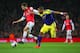 LONDON, ENGLAND - MARCH 25: Mathieu Flamini of Arsenal and Ashley Williams of Swansea City battle for the ball during the Barclays Premier League match between Arsenal and Swansea City at Emirates Stadium on March 25, 2014 in London, England. (Photo by