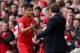 LIVERPOOL, ENGLAND - APRIL 13: Liverpool Manager Brendan Rodgers congratulates Philippe Coutinho as he is substituted during the Barclays Premier League match between Liverpool and Manchester City at Anfield on April 13, 2014 in Liverpool, England. (Pho