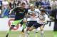 Ryan Mason attempts to tackle former Spurs-teammate Clint Dempsey. The midfielder held his own against Seattle without especially standing out.