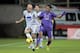 FLORENCE, ITALY - FEBRUARY 08: Guillermo Cuadrado (R) of ACF Fiorentina fights for the ball with Giulio Migliaccio of Atalanta BC during the Serie A match between ACF Fiorentina and Atalanta BC at Stadio Artemio Franchi on February 8, 2014 in Florence, It