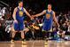 NEW YORK, NY - FEBRUARY 28: Klay Thompson #11 of the Golden State Warriors high-fives teammate Stephen Curry #30 during a game against the New York Knicks at Madison Square Garden in New York City on February 28, 2014. NOTE TO USER: User expressly acknow