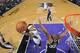 SACRAMENTO, CA - MARCH 21: Isaiah Thomas #22 of the Sacramento Kings shoots a layup against Boris Diaw #33 of the San Antonio Spurs on March 21, 2014 at Sleep Train Arena in Sacramento, California. NOTE TO USER: User expressly acknowledges and agrees that