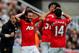 NEWCASTLE UPON TYNE, ENGLAND - APRIL 05: Juan Mata of Manchester United (L) celebrates with team mate Javier Hernandez after scoring their first goal during the Barclays Premier League match between Newcastle United and Manchester United at St James' Park