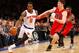NEW YORK, NY - APRIL 16: J.R. Smith #8 of the New York Knicks is defended by Tyler Hansbrough #50 of the Toronto Raptors in the second half during an NBA basketball game at Madison Square Garden on April. 16, 2014 in New York City. The Knicks defeated the