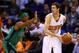 Feb 19, 2014; Phoenix, AZ, USA; Boston Celtics guard Rajon Rondo (left) defends Phoenix Suns guard Goran Dragic in the first half at US Airways Center. Mandatory Credit: Mark J. Rebilas-USA TODAY Sports