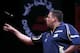 DUBAI, UNITED ARAB EMIRATES - MAY 30: Adrian Lewis of England plays against Michael Van Grewen of the Netherlands during the 2014 Dubai Duty Free Darts Masters Semi-Final match at Dubai Duty Free Tennis Stadium, Irish Village on May 30, 2014 in Dubai, Un