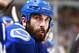 VANCOUVER, BC - MARCH 23: Jason Garrison #5 of the Vancouver Canucks looks on from the bench during their NHL game against the Buffalo Sabres at Rogers Arena March 23, 2014 in Vancouver, British Columbia, Canada. Vancouver won 4-2. (Photo by Jeff Vinnic