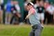 Jul 20, 2014; Wirral, GBR; Rory McIlroy throws his ball into the crowd after holing the winning putt during the final round at the 143rd Open Championship at The Royal Liverpool Golf Club. Mandatory Credit: Steve Flynn-USA TODAY Sports