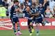 Jul 19, 2014; Kansas City, KS, USA; Sporting KC mid-fielder Benny Feilhaber (10) celebrates with teammates Graham Zusi (8) and Soony Saad (22) after scoring a goal off a free kick against the Los Angeles Galaxy during the first half at Sporting Park. Mand