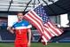 May 1, 2014; Kansas City, KS, USA; Matt Besler holds the US Flag while wearing the US National Soccer Team uniform at Sporting Park. Mandatory Credit: Gary Rohman/Sporting KC-USA TODAY Sports