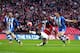 LONDON, ENGLAND - APRIL 12: Yaya Sanogo of Arsenal kicks the ball under the watchful eye of Gary Caldwell of Wigan Athletic during the FA Cup Semi-Final match between Wigan Athletic and Arsenal at Wembley Stadium on April 12, 2014 in London, England. (P