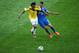 BELO HORIZONTE, BRAZIL - JUNE 14: Juan Guillermo Cuadrado of Colombia and Jose Cholevas of Greece battle for the ball during the 2014 FIFA World Cup Brazil Group C match between Colombia and Greece at Estadio Mineirao on June 14, 2014 in Belo Horizonte, B