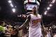 PHOENIX, AZ - APRIL 14: Eric Bledsoe #2 of the Phoenix Suns high fives fans as he walks off the court following the NBA game against the Memphis Grizzlies at US Airways Center on April 14, 2014 in Phoenix, Arizona. The Grizzlies defeated the Suns 97-91.