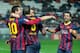 SEVILLE, SPAIN - FEBRUARY 09: Lionel Messi (L) of FC Barcelona celebrates scoring their third goal with teammates Andres Iniesta (2ndL), Pedro Rodriguez Ledesma (2ndR) and Xavi Hernandez (R) during the La Liga match between Sevilla FC and FC Barcelona at