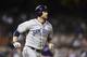 Jul 7, 2014; Denver, CO, USA; San Diego Padres third baseman Chase Headley (7) runs after hitting a RBI triple in the seventh inning against the Colorado Rockies at Coors Field. Mandatory Credit: Ron Chenoy-USA TODAY Sports