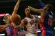 CHICAGO, IL - OCTOBER 16: Derrick Rose #1 of the Chicago Bulls passes between Kyle Singler #25 and Greg Monroe #10 of the Detroit Pistons during a preseason game at the United Center on October 16, 2013 in Chicago, Illinois. NOTE TO USER: User expressly a