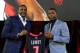 TORONTO, ON - JULY 10: Masai Ujiri and Kyle Lowry during the press conference after his singing of a contract extension with the Toronto Raptors at the Air Canada Centre on July 10, 2014 in Toronto, Ontario, Canada. NOTE TO USER: User expressly acknowled