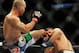 Jul 27, 2013; Seattle, WA, USA; Robbie Lawler (red tape) lands a kick to the head of Bobby Voelker (blue tape) during their welterweight bout at Key Arena. Lawler won by a TKO in the second round. Mandatory Credit: Jayne Kamin-Oncea-USA TODAY Sports