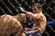 Jan 15, 2014; Duluth, GA, USA; Luke Rockhold (red gloves) fights Costas Philippou (blue gloves) during UFC Fight Night at Gwinnett Center. Rockhold wins. Mandatory Credit: Joshua S. Kelly-USA TODAY Sports