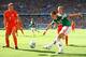 FORTALEZA, BRAZIL - JUNE 29: Javier Hernandez of Mexico strikes the ball against Stefan de Vrij of the Netherlands during the 2014 FIFA World Cup Brazil Round of 16 match between Netherlands and Mexico at Castelao on June 29, 2014 in Fortaleza, Brazil. (