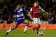 READING, ENGLAND - OCTOBER 30: Thomas Eisfeld of Arsenal is challenged by Jobi McAnuff of Reading during the Capital One Cup Fourth Round match between Reading and Arsenal at Madejski Stadium on October 30, 2012 in Reading, England. (Photo by Scott Heav