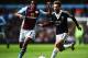 BIRMINGHAM, ENGLAND - APRIL 19: (L-R) Leandro Bacuna of Aston Villa and Adam Lallana of Southampton challenge for the ball during the Barclays Premier League match between Aston Villa and Southampton at Villa Park on April 19, 2014 in Birmingham, England