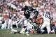 LOS ANGELES - SEPTEMBER 28: Running back Lionel James #26 of the San Diego Chargers rushes for yards as linebacker Rod Martin #53 of the Los Angeles Raiders applies pressure during a game at the Los Angeles Memorial Coliseum on September 28, 1986 in Los