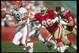 28 Oct 1990: Quarterback Bernie Kosar of the Cleveland Browns (left) scrambles to avoid a San Francisco 49ers player during a game at Candlestick Park in San Francisco, California. The 49ers won the game, 20-17.