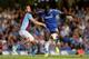 LONDON, ENGLAND - AUGUST 21: Romelu Lukaku of Chelsea holds off the challenge from Ron Vlaar of Aston Villa during the Barclays Premier League match between Chelsea and Aston Villa at Stamford Bridge on August 21, 2013 in London, England. (Photo by Scot