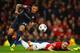 MANCHESTER, ENGLAND - MARCH 19: Robin van Persie of Manchester United is fouled in the penalty box by Jose Holebas of Olympiacos during the UEFA Champions League Round of 16 second round match between Manchester United and Olympiacos FC at Old Trafford o