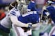EAST RUTHERFORD, NJ - NOVEMBER 24: Jason Hatcher #97 of the Dallas Cowboys sacks Eli Manning #10 of the New York Giants during their game at MetLife Stadium on November 24, 2013 in East Rutherford, New Jersey. (Photo by Al Bello/Getty Images)