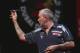 DUBAI, UNITED ARAB EMIRATES - MAY 29: Phil Taylor of England plays against Peter Wright of England during the 2014 Dubai Duty Free Darts Masters Quarter-Final match at Dubai Duty Free Tennis Stadium, Irish Village on May 29, 2014 in Dubai, United Arab E