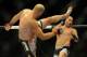 Aug 31, 2013; Milwaukee, WI, USA; Ben Rothwell (left) fights Brandon Vera during the UFC-164 bout at BMO Harris Bradley Center. Mandatory Credit: Benny Sieu-USA TODAY Sports