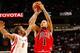 HOUSTON - FEBRUARY 03: Derrick Rose #1 of the Chicago Bulls shoots the ball over Aaron Brooks #0 of the Houston Rockets during the game on February 3, 2009 at the Toyota Center in Houston, Texas. The Rockets won 107-100. NOTE TO USER: User expressly ac