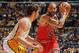 LOS ANGELES, CA - DECEMBER 25: Carlos Boozer #5 of the Chicago Bulls is defended by Pau Gasol #16 of the Los Angeles Lakers at Staples Center on December 25, 2011 in Los Angeles, California. NOTE TO USER: User expressly acknowledges and agrees that, by d