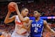 SYRACUSE, NY - FEBRUARY 01: Quinn Cook #2 of the Duke Blue Devils reaches to knock the ball out of the hands of Tyler Ennis #11 of the Syracuse Orange during overtime at the Carrier Dome on February 1, 2014 in Syracuse, New York. Syracuse defeated Duke