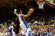 DURHAM, NC - DECEMBER 16: Quinn Cook #2 of the Duke Blue Devils drives to the basket against Josh Castellanos #3 of the Gardner-Webb Runnin' Bulldogs during play at Cameron Indoor Stadium on December 16, 2013 in Durham, North Carolina. (Photo by Grant H