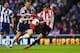 SUNDERLAND, ENGLAND - MAY 07: Fabio Borini of Sunderland (R) beats Gareth McAuley of West Bromwich Albion to score their second goal during the Barclays Premier League match between Sunderland and West Bromwich Albion at Stadium of Light on May 7, 2014 i