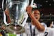 LISBON, PORTUGAL - MAY 24: Raphael Varane of Real Madrid celebrates victory with the trophy after the UEFA Champions League Final between Real Madrid and Atletico de Madrid at Estadio da Luz on May 24, 2014 in Lisbon, Portugal. (Photo by Alex Livesey/Ge