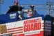 Dale Earnhardt Jr and team watch practice at Daytona International Speedway on top of the No. 88 hauler.