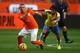 AMSTERDAM, NETHERLANDS - MAY 17: Jordy Clasie of Holland looks to hold of Ecuador's Joao Rojas during the International Friendly match between The Netherlands and Ecuador at The Amsterdam Arena on May 17, 2014 in Amsterdam, Netherlands. (Photo by Charlie