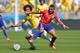 BELO HORIZONTE, BRAZIL - JUNE 28: Alexis Sanchez of Chile and Marcelo of Brazil compete for the ball during the 2014 FIFA World Cup Brazil round of 16 match between Brazil and Chile at Estadio Mineirao on June 28, 2014 in Belo Horizonte, Brazil. (Photo
