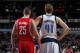 DALLAS, TX - JANUARY 29: Dirk Nowitzki #41 of the Dallas Mavericks and Chandler Parsons #25 of the Houston Rockets on January 29, 2014 at the American Airlines Center in Dallas, Texas. NOTE TO USER: User expressly acknowledges and agrees that, by download