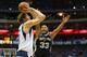 DALLAS, TX - MAY 02: Dirk Nowitzki #41 of the Dallas Mavericks takes a shot against Boris Diaw #33 of the San Antonio Spurs in Game Six of the Western Conference Quarterfinals during the 2014 NBA Playoffs at American Airlines Center on May 2, 2014 in Dal