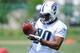 NASHVILLE, TN - MAY 16: Second round pick Bishop Sankey #20 works out during the Tennessee Titans rookie minicamp on May 16, 2014 in Nashville, Tennessee. (Photo by Frederick Breedon/Getty Images)