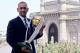 MUMBAI, INDIA - APRIL 03: India's cricket team captain Mahendra Singh Dhoni poses with the ICC Cricket World Cup Trophy, with the Gateway of India in the backdrop, during a photo call at the Taj Palace Hotel on April 3, 2011 in Mumbai, India. (Photo by