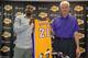 EL SEGUNDO, CA - JULY 23: Ed Davis #21 and Mitch Kupchak of the Los Angeles Lakers pose for a photo during a press conference on July 23, 2014 at the Toyota Sports Center in El Segundo, California. NOTE TO USER: User expressly acknowledges and agrees tha