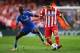 LONDON, ENGLAND - APRIL 30: Koke of Club Atletico de Madrid is tackled by Ramires of Chelsea during the UEFA Champions League semi-final second leg match between Chelsea and Club Atletico de Madrid at Stamford Bridge on April 30, 2014 in London, England.