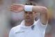 NOTTINGHAM, ENGLAND - JULY 12: James Anderson of England wipes his brow during day four of 1st Investec Test match between England and India at Trent Bridge on July 12, 2014 in Nottingham, England. (Photo by Gareth Copley/Getty Images)