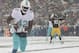 Dec 8, 2013; Pittsburgh, PA, USA; Miami Dolphins tight end Charles Clay (42) scores a touchdown as Pittsburgh Steelers linebacker Jason Worilds (93) stands in the background during the first half at Heinz Field. Mandatory Credit: Jason Bridge-USA TODAY Sp